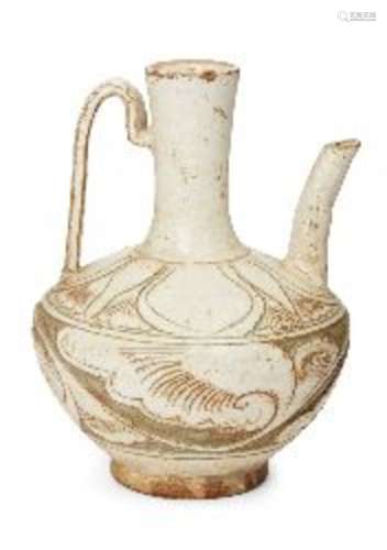 A Chinese grey stoneware Cizhou ewer, deeply incised beneath the transparent pale glaze with a