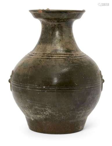 A Chinese bronze-imitation pottery jar, Hu, Han dynasty, the sides moulded with taotie mask and ring