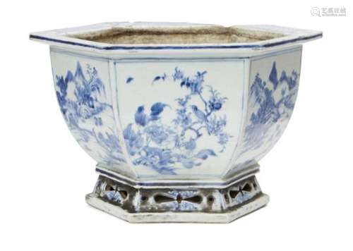 A Chinese porcelain hexagonal jardinière, 18th century, painted in underglaze blue with panels of