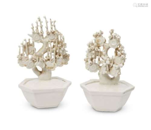 A pair of Chinese Dehua porcelain models of trees, early 20th century, each modelled as a blossoming