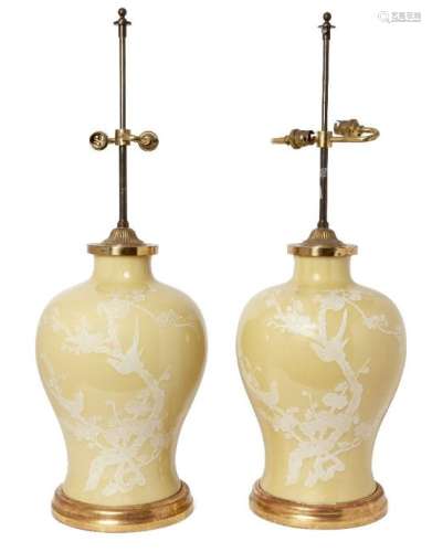 A pair of Chinese porcelain yellow ground baluster vases, early 20th century, each decorated in