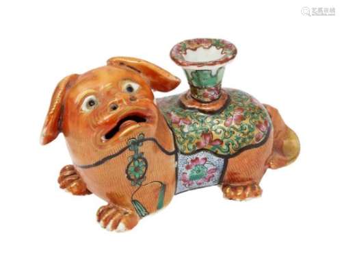 A Chinese porcelain lion dog taper-stick holder, late Qing dynasty, painted in famille rose