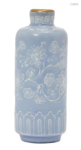 A Chinese porcelain cylindrical snuff bottle, Republic period, decorated in white slip with