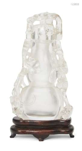 A Chinese rock crystal double gourd vase and cover, 19th century, carved as a double gourd and