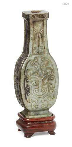 A Chinese archaistic hardstone vase, early 20th century, carved in low relief to the flattened