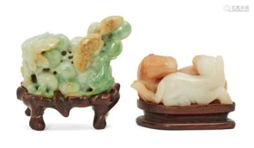 A Chinese jadeite carving depicting a squirrel and grapes, late 19th century, carved as a squirrel