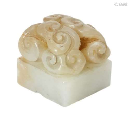 A Chinese green jade square seal, late Qing dynasty, carved with a cluster of lingzhi-form clouds,