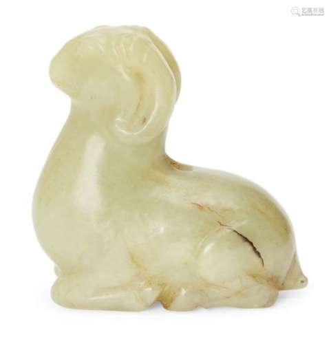 A Chinese yellow jade carving of a ram, with legs tucked under its body and head raised, 5cm