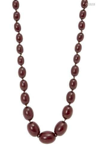 A cherry amber graduated bead necklace, late 19th century, consisting of forty-three oval beads, 1cm