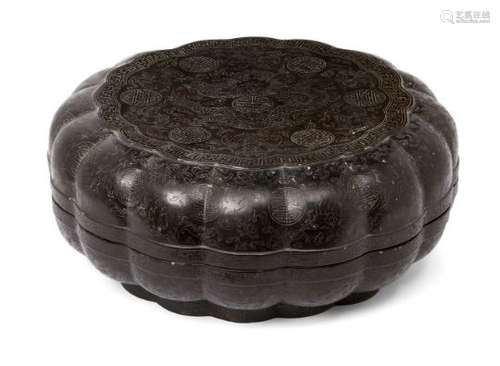 A large Chinese black lacquer lobed circular box, early 20th century, incised throughout with