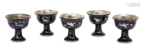 A set of five lac burgauté mother of pearl inlaid stem cups, Kangxi period, each with white metal