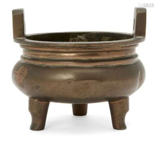 A Chinese bronze circular tripod censer, 18th century, cast four-character mark to base, 12cm