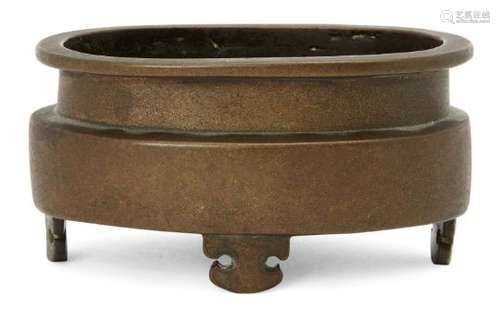 A Chinese bronze oval censer, 18th century, raised on four ruyi-form feet, apocryphal Xuande mark to