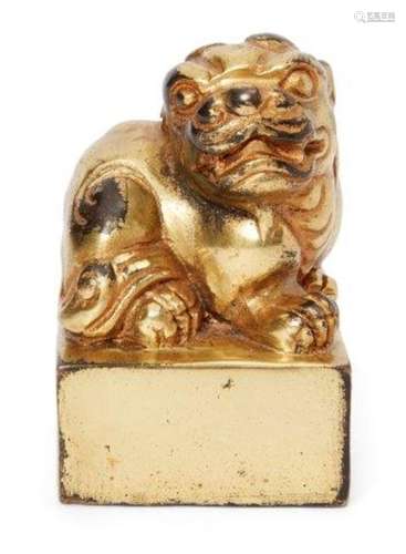 A Chinese gilt bronze square seal, early 20th century, cast as a seated Buddhist lion, 8cm