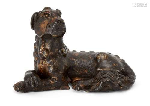 A Chinese parcel gilt bronze 'mythical beast' scroll weight, Ming dynasty, cast with goat-head and