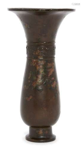 A Chinese bronze archaistic vase, Ming dynasty, 17th century, decorated to the waisted neck with a