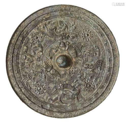 A large Chinese bronze Tang style circular mirror, 20th century, cast with deities and mythical