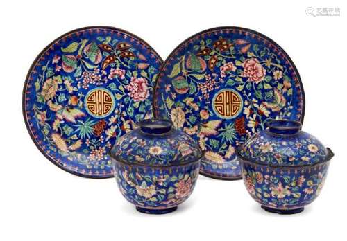 A pair of Chinese Canton enamel bowls with covers and stands, early 19th century, each painted