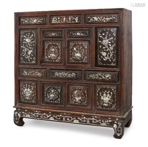 A Chinese hardwood and mother-of-pearl inlaid table top cabinet, 19th century, with arrangement of