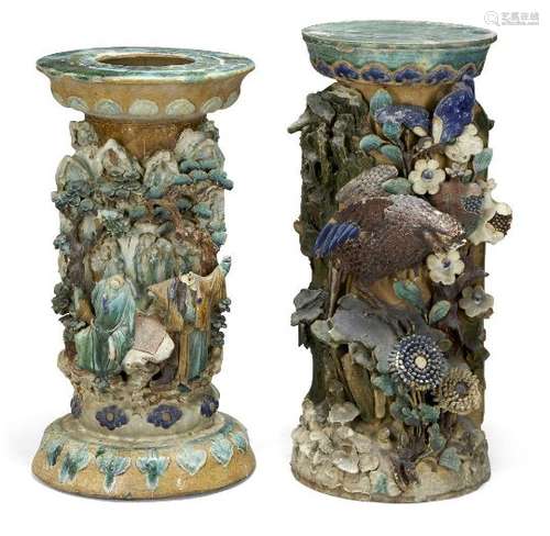 A pair of Chinese stoneware jardiniere stands, 19th century, decorated in high relief in