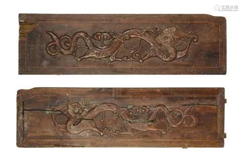 A pair of Chinese wood rectangular panels, 19th century, each decorated in relief with chi-long