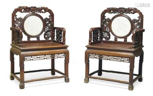 A pair of Chinese hardwood armchairs, 19th century, the carved backs set with circular marble