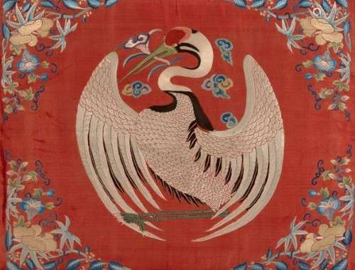 A pair of Chinese silk embroidered panels, 19th century, decorated with red-crested crane roundels