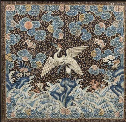 A pair of Chinese silk embroidered rank badges, late Qing dynasty, decorated with cranes amidst bats