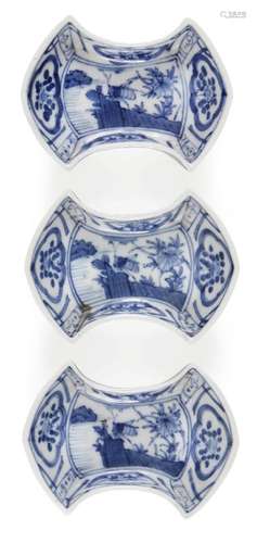 Three Japanese porcelain ingot shaped dishes, Meiji period, painted in underglaze blue with