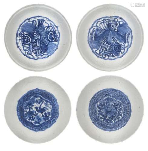 A pair of Japanese porcelain dishes, late 17th century, painted in underglaze blue to the central