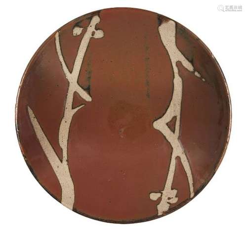 Shoji Hamada, Japanese 1894-1978, a stoneware dish with tenmoku glaze, diameter 27.5cm Provenance: