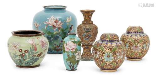 A pair of Japanese raised cloisonné jars, Meiji period, decorated with scrolling vines amongst