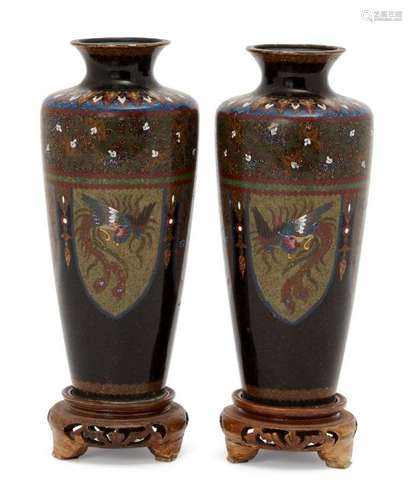 A pair of Japanese cloisonné vases, Meiji period, decorated with alternating panels of dragons and