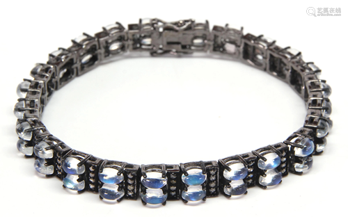 Moonstone, diamond, blackened silver…