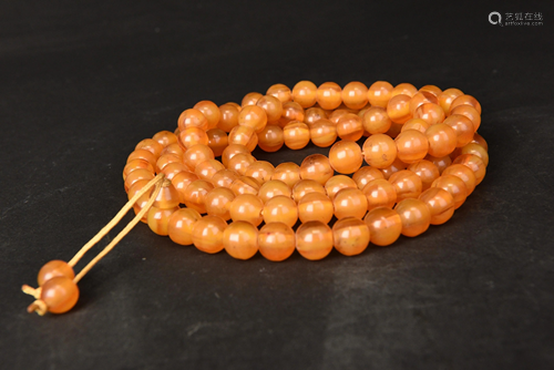 A string of amber beads, L66 cm x 2 cm