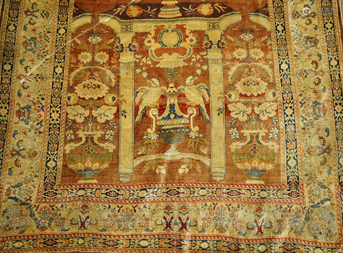 An antique silk Persian carpet