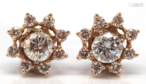 Pair of diamond, gold earrings and jackets