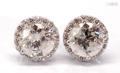 Pair of diamond, 18k white gold earrings