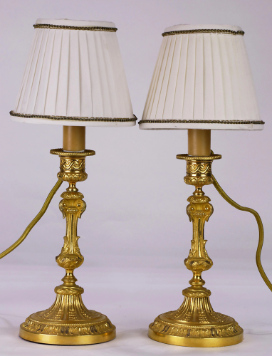 A pair of French ormolu mounted candlesti…