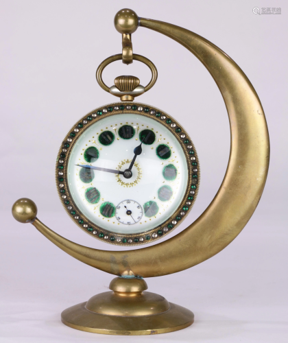 An antique magnified lens desk clock