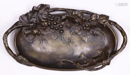 A patinated bronze oval tray in the Art Nouv…