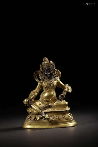 GILT BRONZE CAST 'YELLOW JAMBHALA' SEATED FIGURE