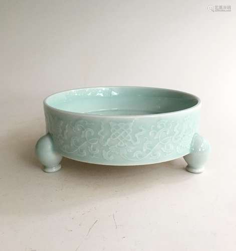 CELADON GLAZED AND IMPRESSED 'EIGHT TREASURES' TRIPOD CENSER