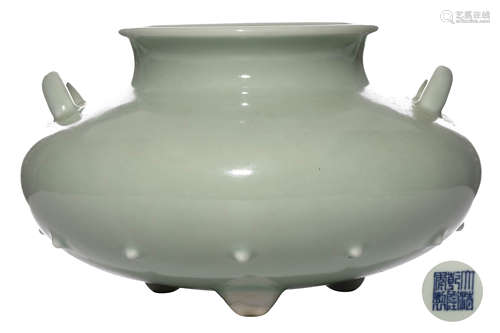 A CHINESE PEA GREEN GLAZED PORCELAIN THREE LEGGED CENSER