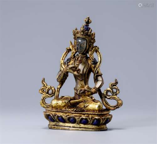 A Chinese Carved Rock Crystal and Gilt Bronze Figure of Buddha