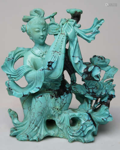 CARVED TURQUOISE FIGURE OF A LADY PLAYING INSTRUMENT