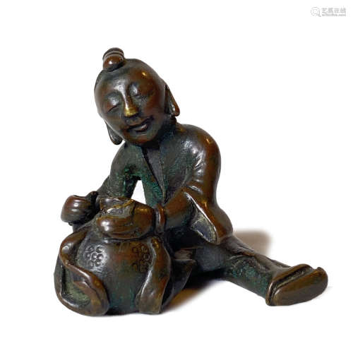 A SMALL BRONZE 'BOY' PAPERWEIGHT, LATE MING/ EARLY QING