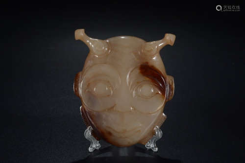 A Chinese Carved Hetian Jade Mask