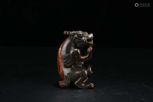 A Chinese Carved Gaogu Jade Beast Ornament