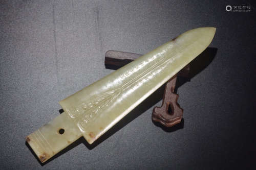 A Chinese Inscribed Hetian Jade Weaponry